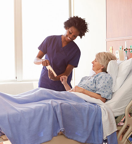 Nurse going over medication list with patient